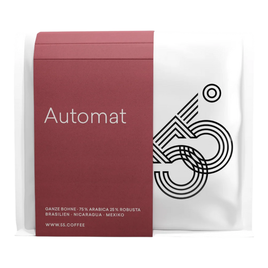Kaffeekontor Bayern Automat coffee beans in a white bag with a dark red label featuring 55 Degrees branding