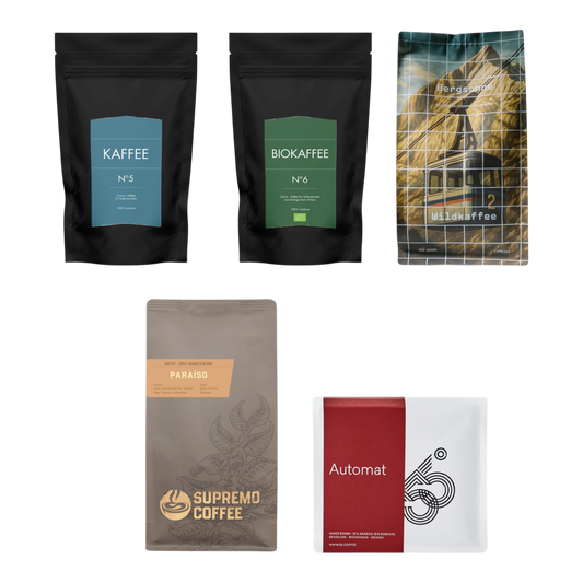 Kaffeekontor Bayern coffee sampler pack featuring five distinct bags of mild whole bean coffee for automatic machines.