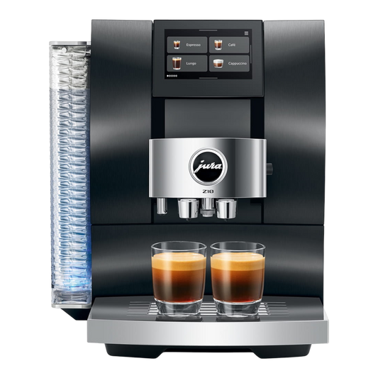 Kaffeekontor Bayern Jura Z10 automatic coffee machine in black with a 5-inch touchscreen and two espresso glasses.